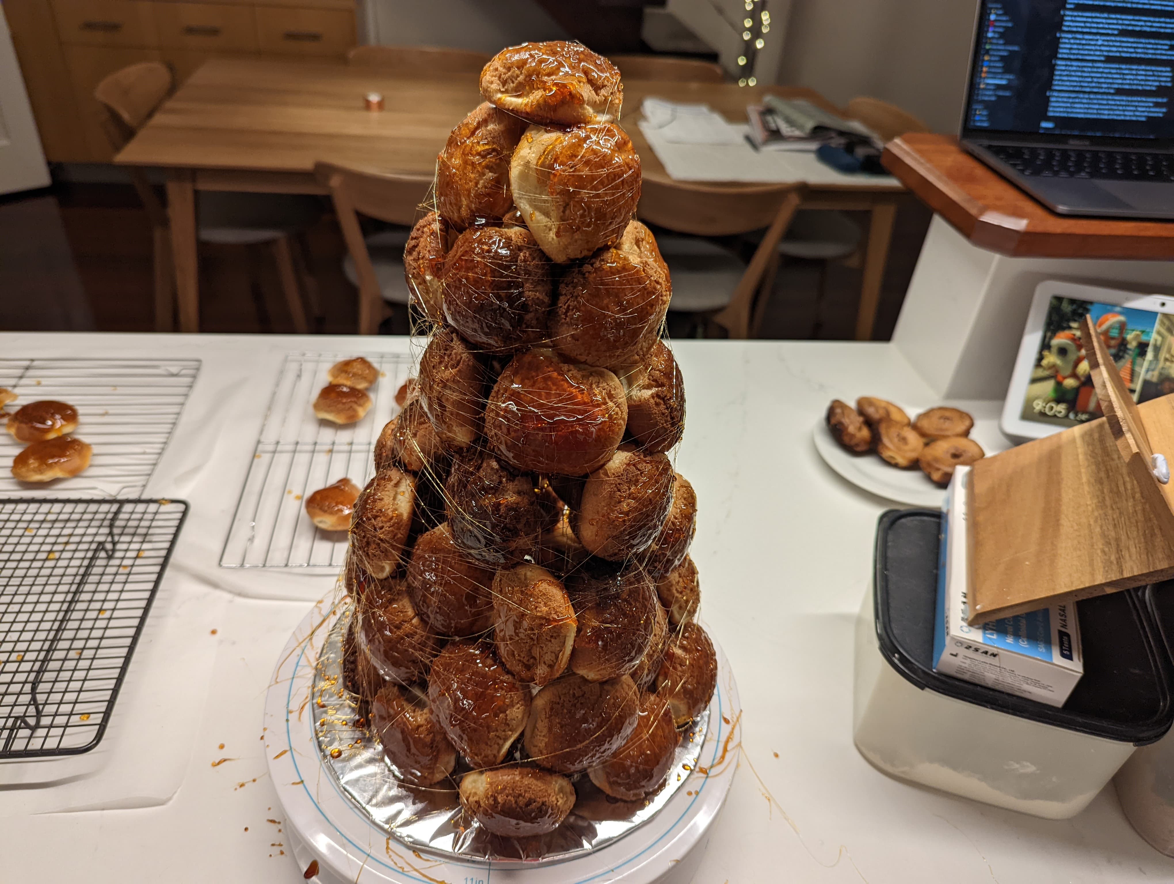 A tower of choux pastries, with sugar strands wrapped around